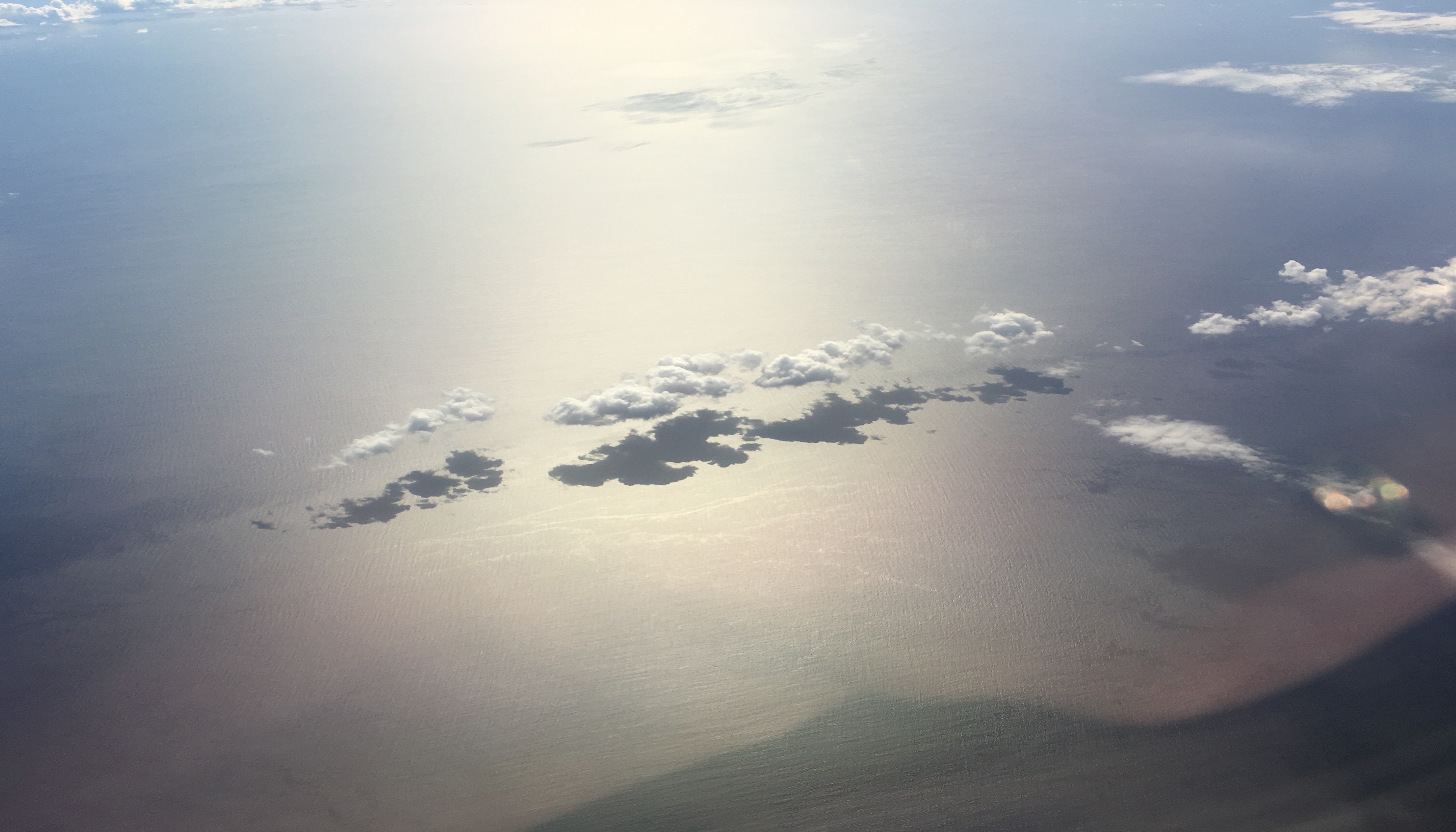 Trade Cumulus Clouds
					   Casting Shadows on the Ocean
